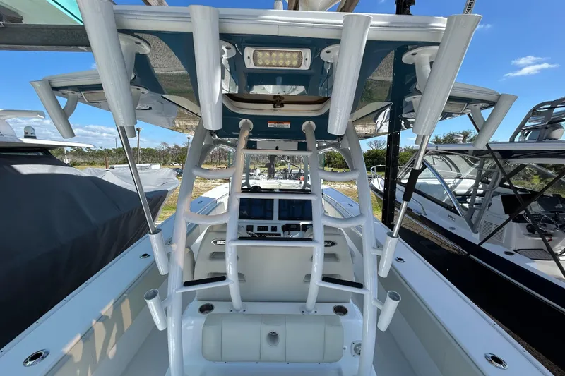 Slide: The Image of 2022 Cape Horn 36 boat interior with rod holders and navigation equipment. - 36