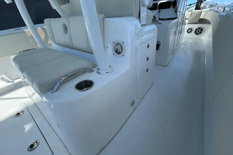 Slide: The Image of 2022 Cape Horn 36 boat interior with white seating and storage compartments. - 38
