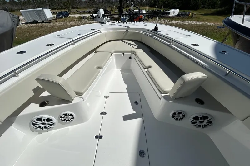 Slide: The Image of 2022 Cape Horn 36 boat interior with cushioned seating and speakers. - 6