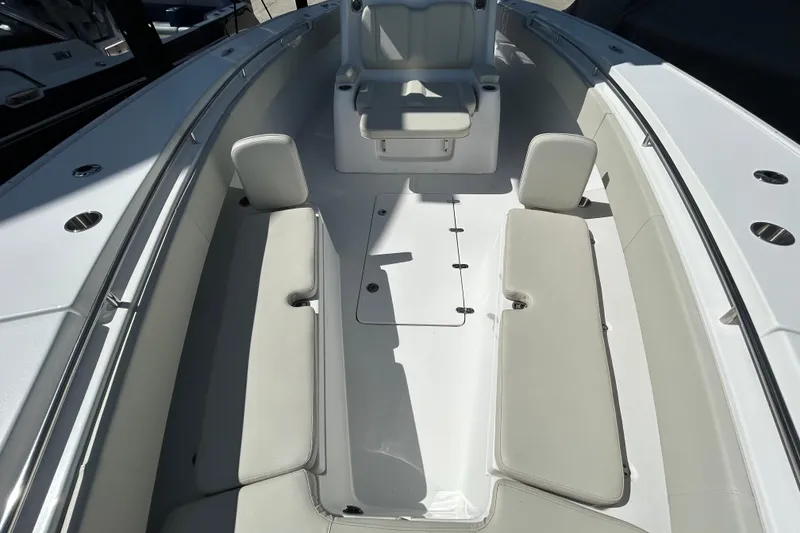 Slide: The Image of 2022 Cape Horn 36 boat interior with cushioned seating and sleek design. - 14