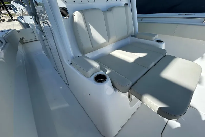 Slide: The Image of 2022 Cape Horn 36 boat interior with cushioned seating and cup holders. - 16