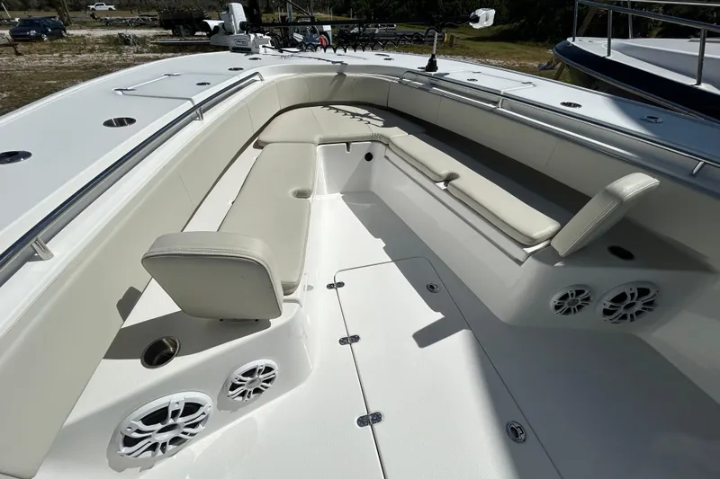 Slide: The Image of 2022 Cape Horn 36 boat interior with white seating and built-in speakers. - 4