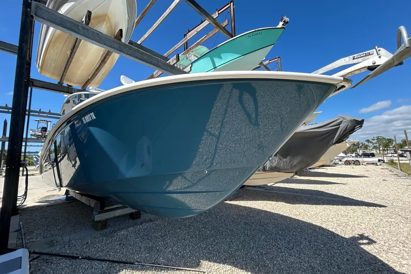 Slide: The Image of 2022 Cape Horn 36 boat in storage, blue hull, sunny day, clear sky. - 49