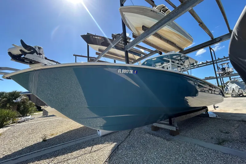 Slide: The Image of 2022 Cape Horn 36 boat in storage, blue hull, sunny day. - 52