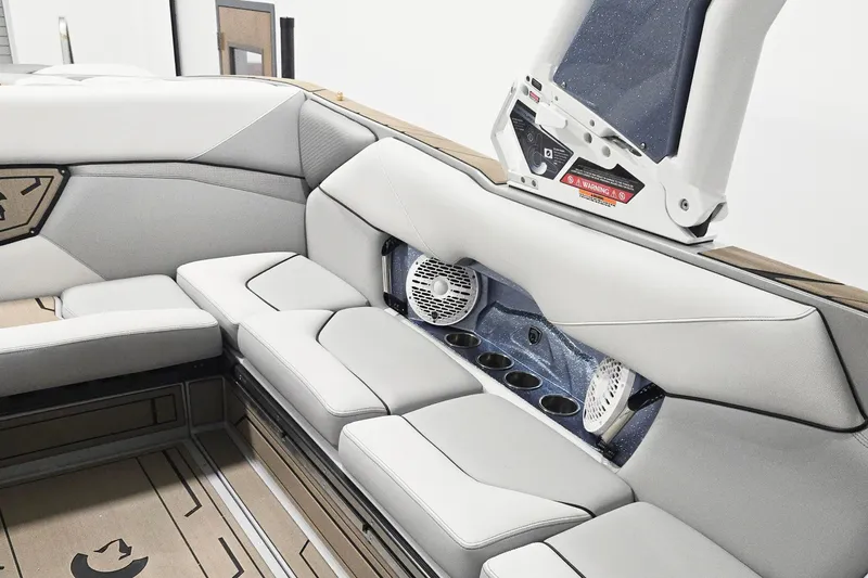 Slide: The Image of Luxurious interior of 2026 Centurion Nv243 boat with plush seating and built-in speakers. - 9