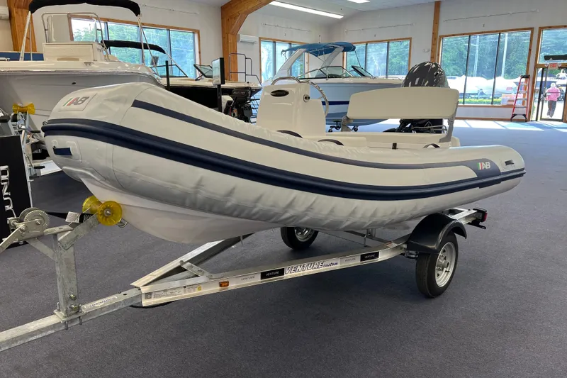 The Image of 2023 AB Inflatables Mares 12 VSX boat on trailer in showroom. - 0