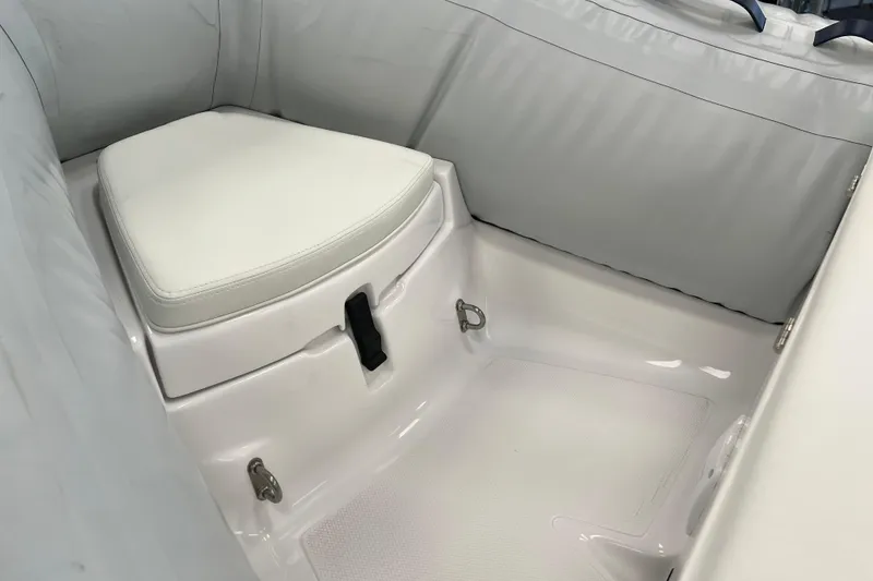 Slide: The Image of 2023 AB Inflatables Mares 12 VSX interior seating with white cushion and sleek design. - 10