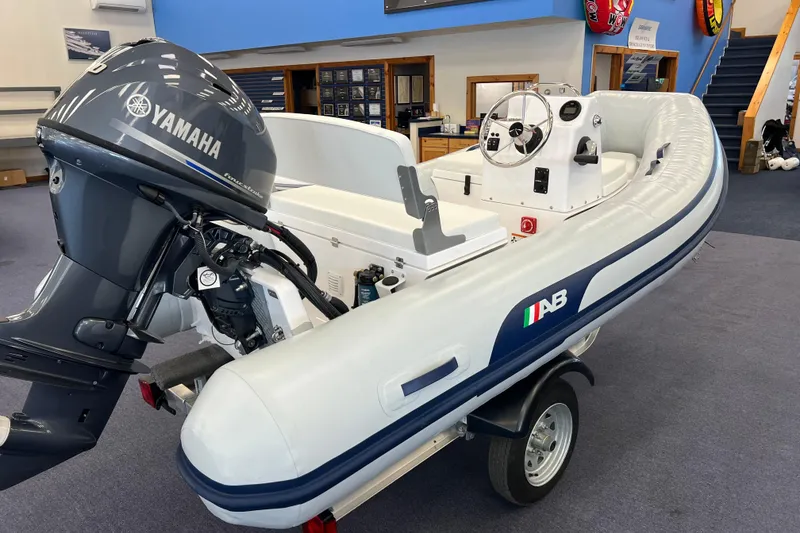 Slide: The Image of 2023 AB Inflatables Mares 12 VSX boat with Yamaha engine in showroom. - 2