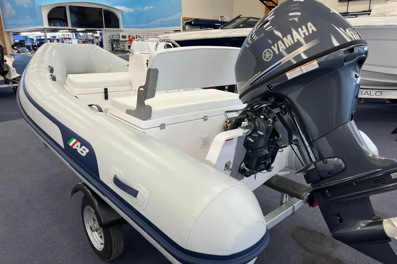 Slide: The Image of 2023 AB Inflatables Mares 12 VSX boat with Yamaha outboard motor displayed indoors. - 3