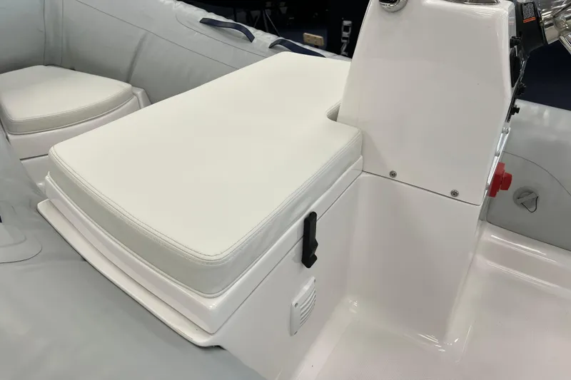 Slide: The Image of 2023 AB Inflatables Mares 12 VSX boat interior with white seating and console. - 8