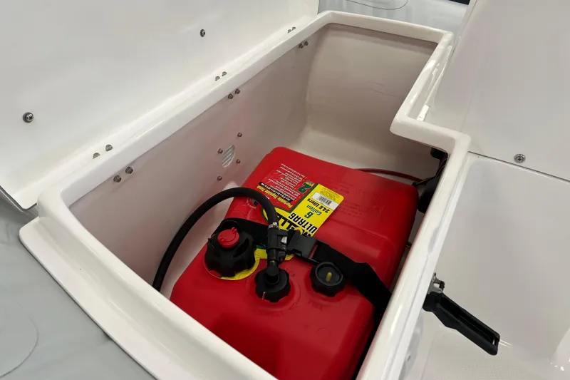 Slide: The Image of 2023 AB Inflatables Mares 12 VSX storage compartment with red fuel tank. - 9