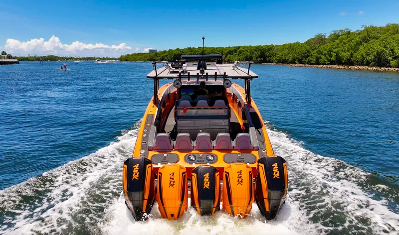 The Image of 2022 Midnight Express 43 Open boat cruising on a sunny day with powerful engines. - 0