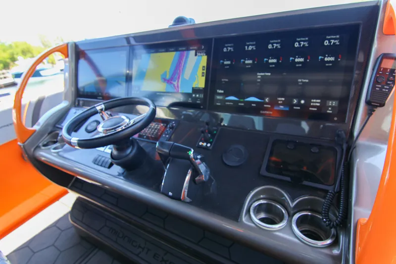 Slide: The Image of 2022 Midnight Express 43 Open boat dashboard with advanced navigation and control systems. - 24