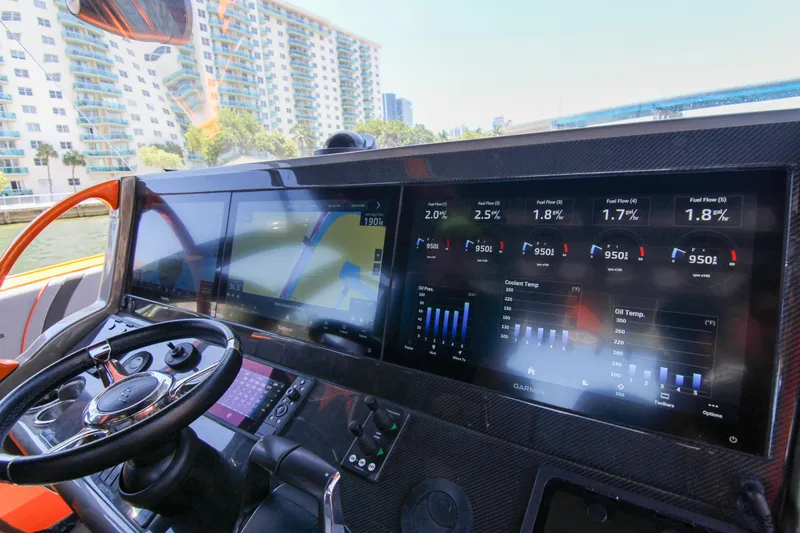 Slide: The Image of Dashboard of 2022 Midnight Express 43 Open boat with advanced navigation and control displays. - 26