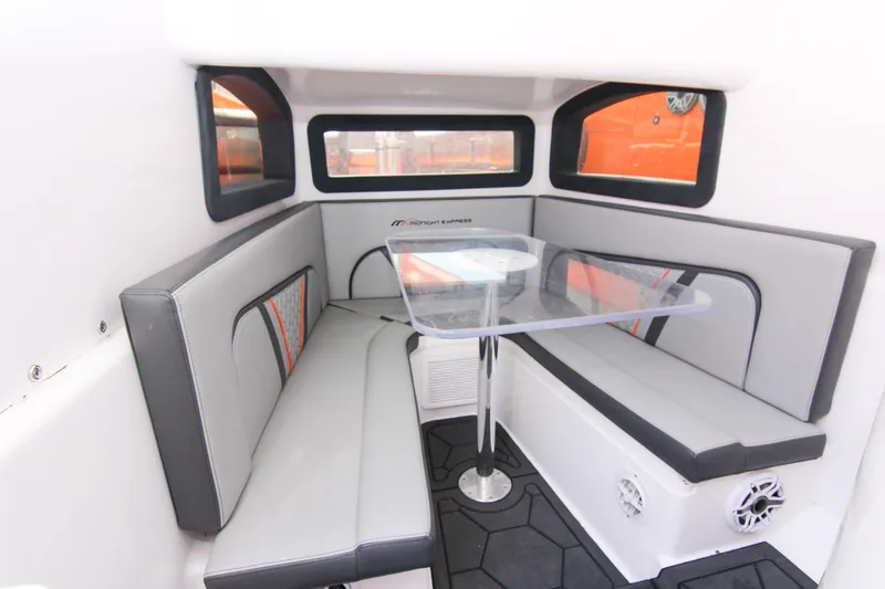 Slide: The Image of Interior of 2022 Midnight Express 43 Open boat with modern seating and table. - 27