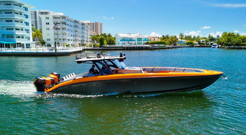 Slide: The Image of 2022 Midnight Express 43 Open boat cruising on a sunny waterfront. - 3