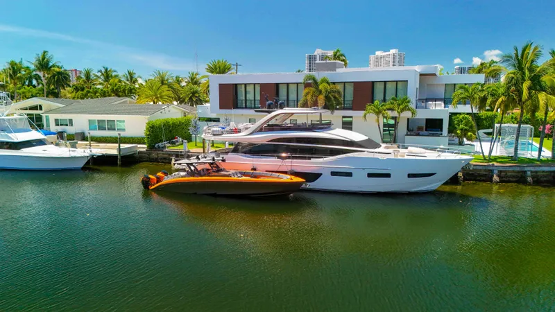 Slide: The Image of Luxury waterfront home with a 2022 Midnight Express 43 Open yacht docked nearby. - 37