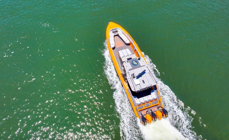 Slide: The Image of Aerial view of 2022 Midnight Express 43 Open boat cruising on green water. - 8