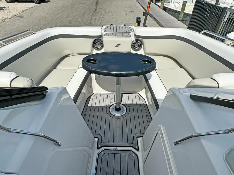 Slide: The Image of 2024 Starcraft SVX 230 OB boat interior with seating and table. - 16