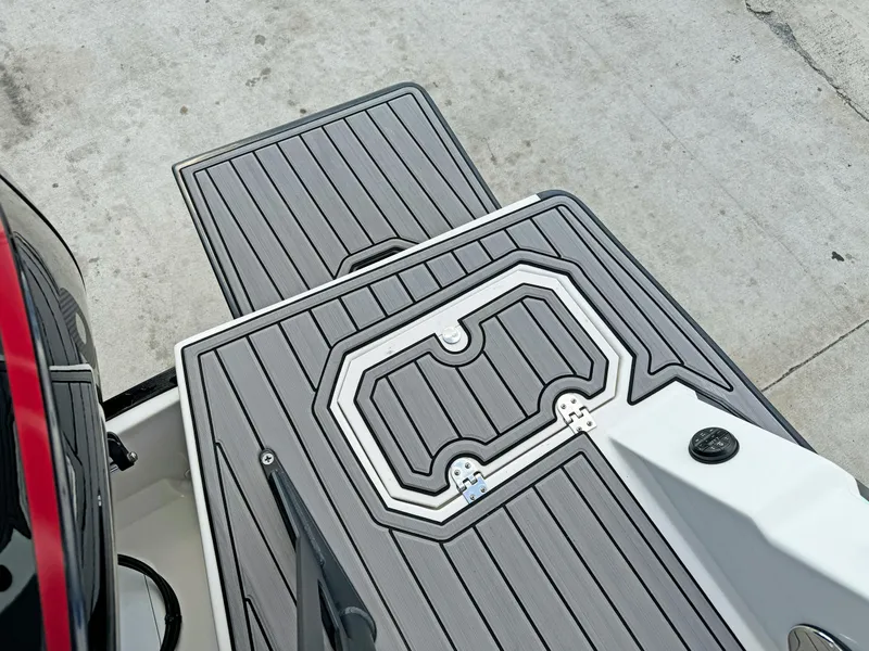 Slide: The Image of 2024 Starcraft SVX 230 OB boat deck with sleek gray non-slip surface. - 25