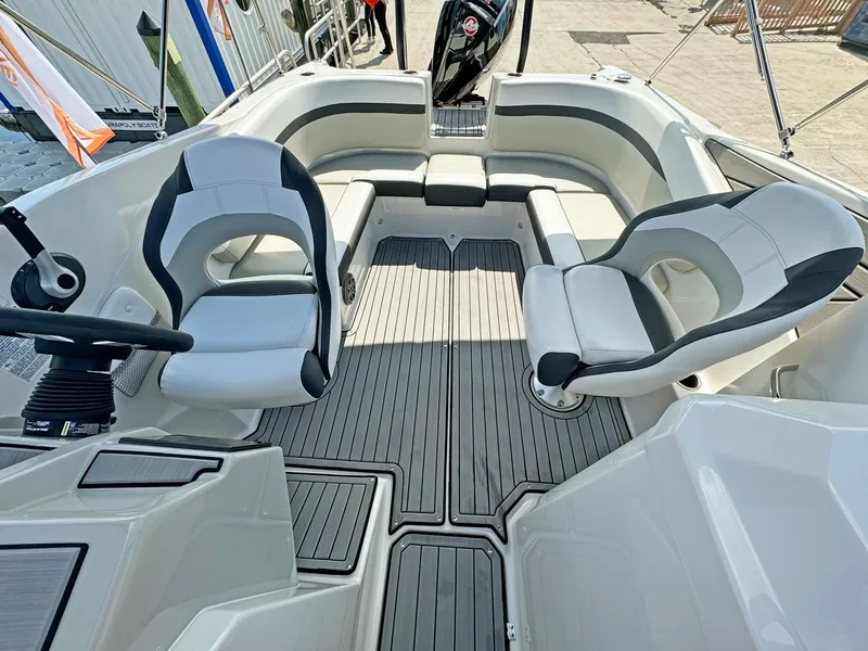 Slide: The Image of 2024 Starcraft SVX 230 OB boat interior with modern seating and sleek design. - 7