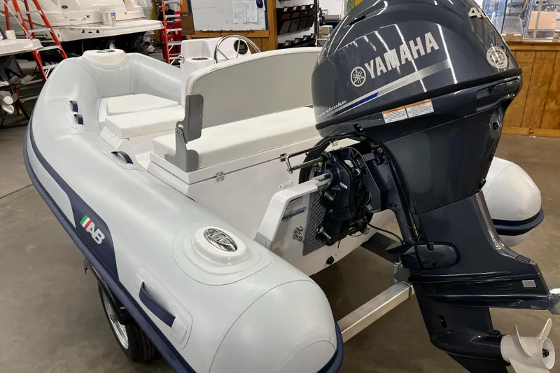 Slide: The Image of 2023 AB Inflatables Mares 11 VSX with Yamaha outboard motor in showroom. - 5