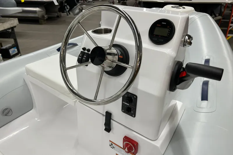Slide: The Image of 2023 AB Inflatables Mares 11 VSX boat console with steering wheel and controls. - 8