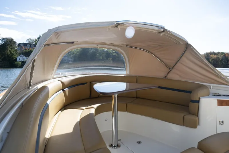 Slide: The Image of 2016 Hunt Yachts 32 Center Console on a scenic river with American flag. - 2