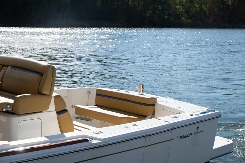 Slide: The Image of 2016 Hunt Yachts 32 Center Console cruising on a scenic river with autumn foliage. - 4
