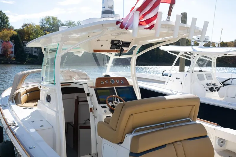 Slide: The Image of 2016 Hunt Yachts 32 Center Console with sleek design and modern navigation equipment. - 22