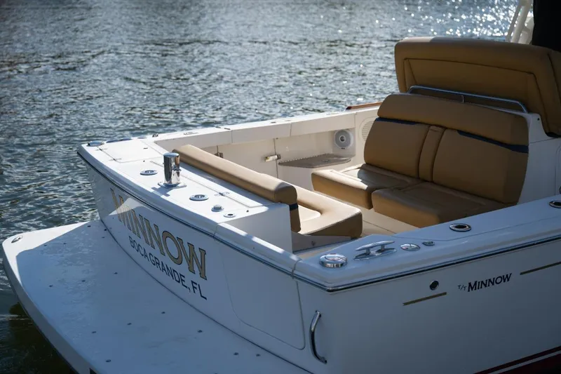 Slide: The Image of 2016 Hunt Yachts 32 Center Console docked, featuring sleek design and comfortable seating. - 31