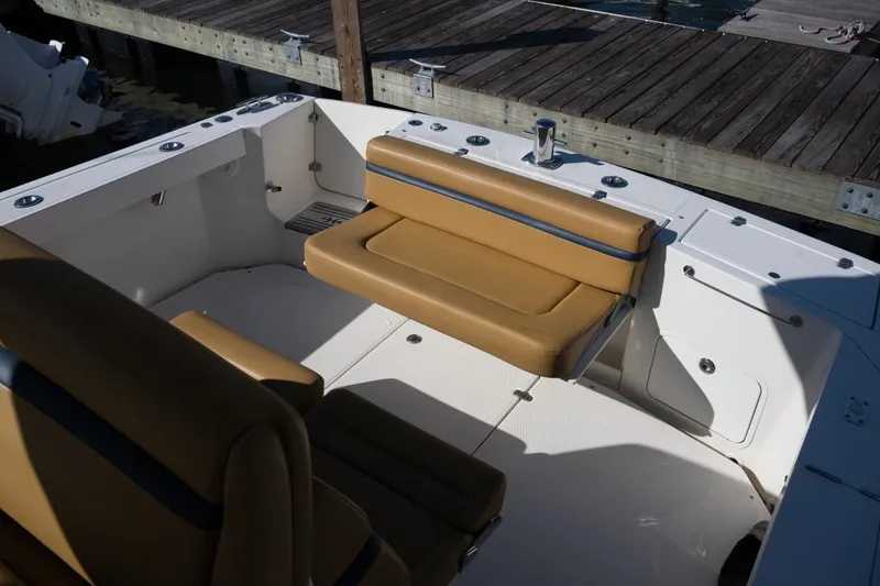 Slide: The Image of 2016 Hunt Yachts 32 Center Console boat with tan seating, docked in Boca Grande, FL. - 32