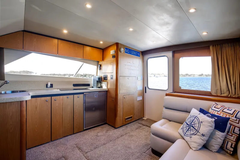 Slide: The Image of 2007 Luhrs Tournament 360 Open yacht interior with modern kitchen and comfortable seating. - 11