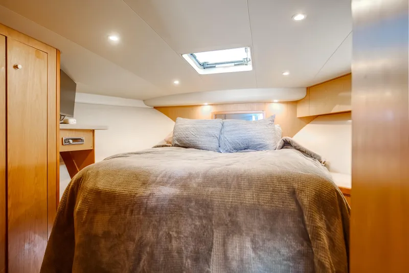 Slide: The Image of Luxurious cabin interior of 2007 Luhrs Tournament 360 Open yacht with cozy bedding. - 15
