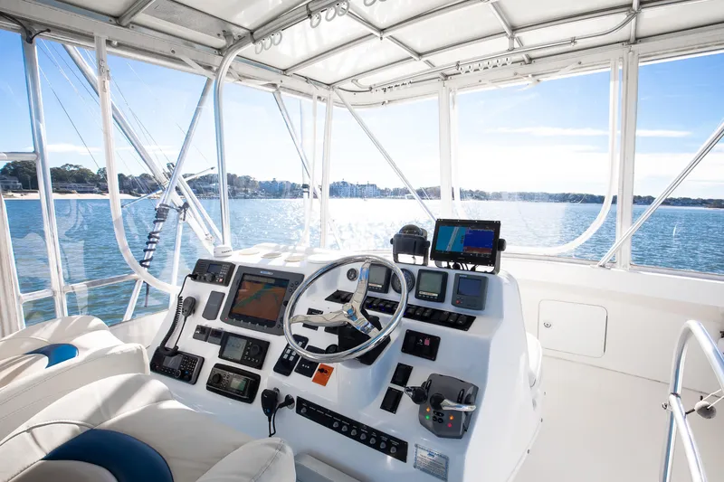 Slide: The Image of 2007 Luhrs Tournament 360 Open helm with navigation equipment, overlooking serene waters. - 4