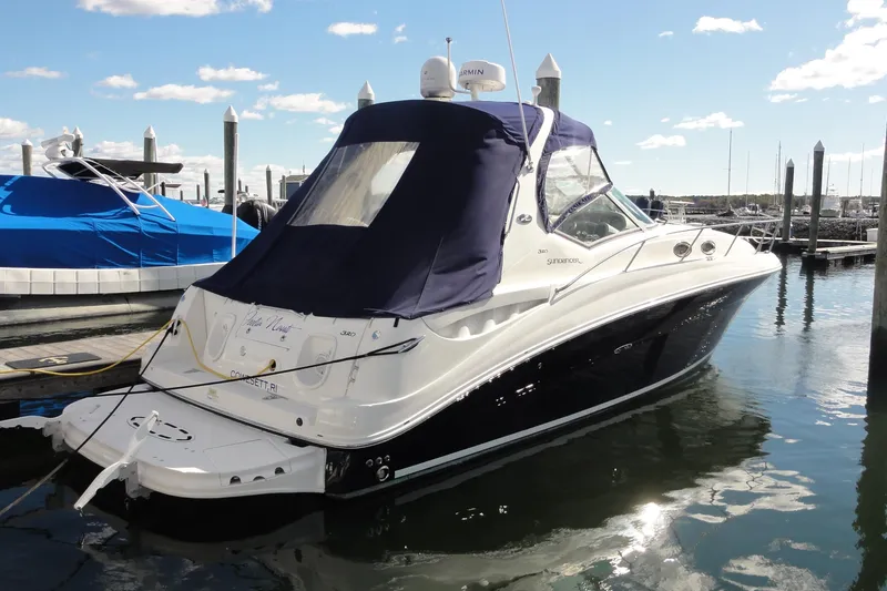 The Image of 2007 Sea Ray 320 Sundancer docked at marina under clear skies. - 0