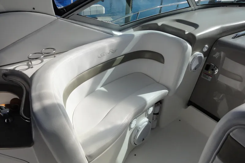 Slide: The Image of 2007 Sea Ray 320 Sundancer interior with white seating and cup holders. - 10