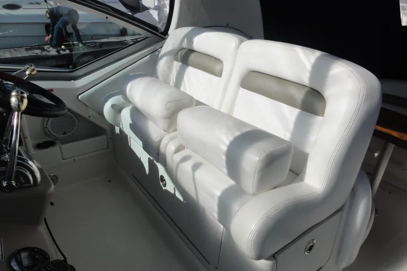Slide: The Image of Luxurious white seating in 2007 Sea Ray 320 Sundancer boat cockpit. - 12