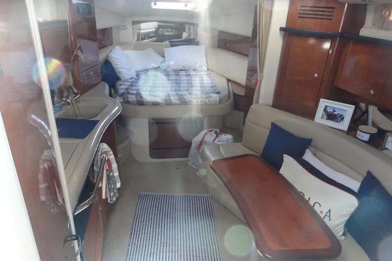 Slide: The Image of Interior of 2007 Sea Ray 320 Sundancer with cozy seating and sleeping area. - 15