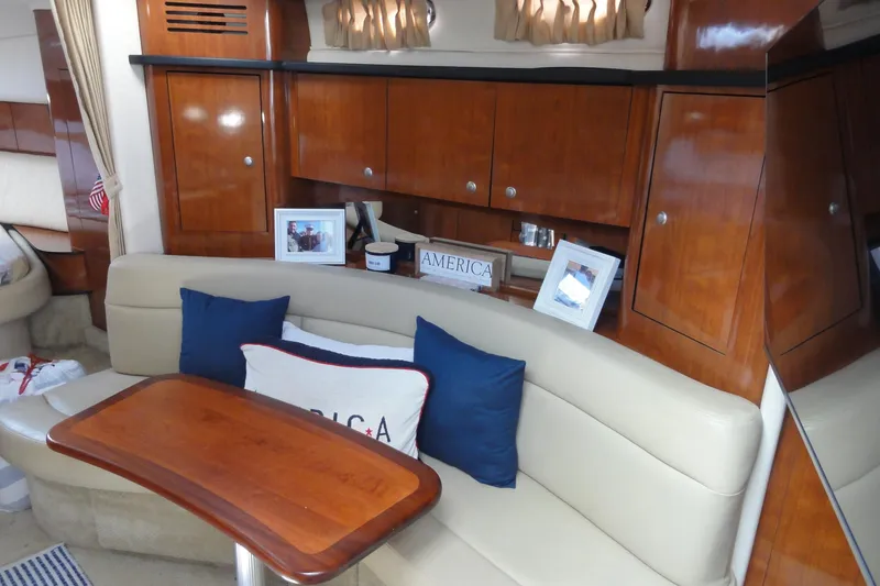 Slide: The Image of Luxurious interior of 2007 Sea Ray 320 Sundancer with elegant wood cabinetry and cozy seating. - 16
