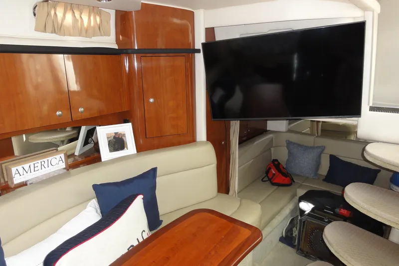 Slide: The Image of Interior of 2007 Sea Ray 320 Sundancer with cozy seating and large TV. - 18