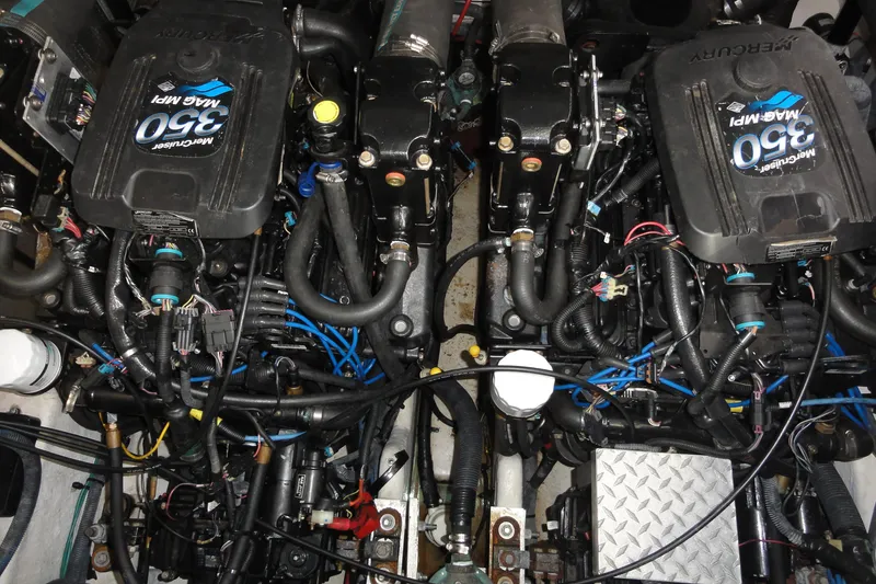 Slide: The Image of Engine compartment of a 2007 Sea Ray 320 Sundancer with twin MerCruiser 350 MAG MPI engines. - 25