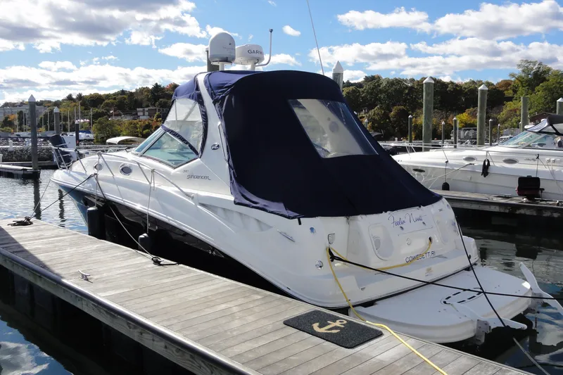 Slide: The Image of 2007 Sea Ray 320 Sundancer docked at marina under clear blue sky. - 4