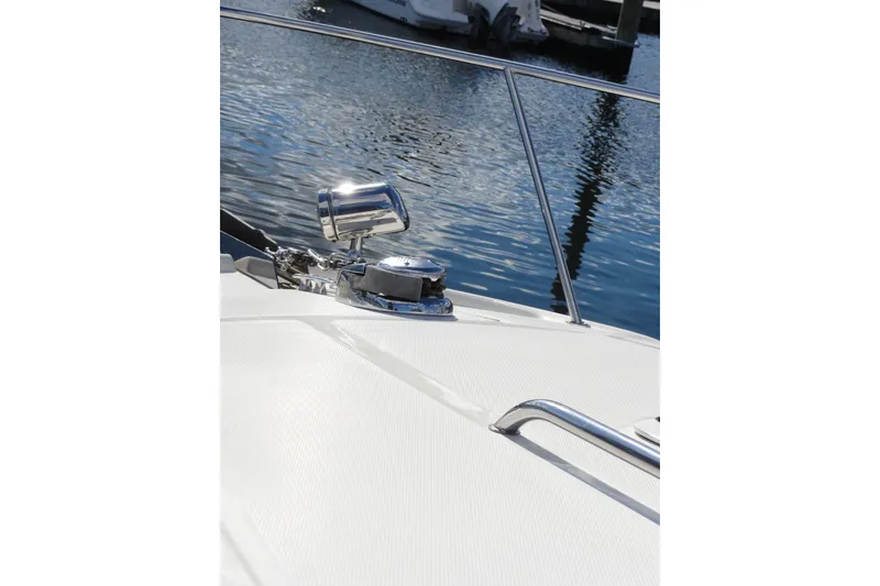 Slide: The Image of 2007 Sea Ray 320 Sundancer bow with chrome fittings and water reflection. - 7