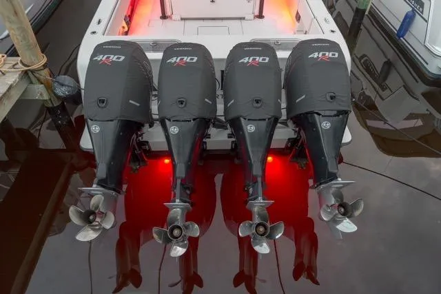 Slide: The Image of 2020 Contender 44 ST boat interior with helm, seating, and navigation equipment at dock. - 15