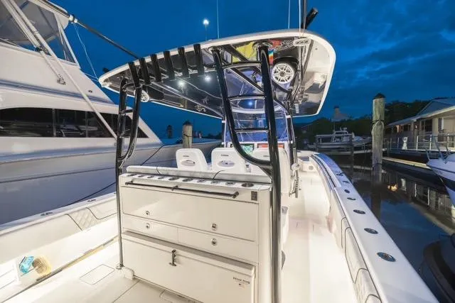 Slide: The Image of 2020 Contender 44 ST boat helm with dual Garmin displays and Mercury controls. - 16