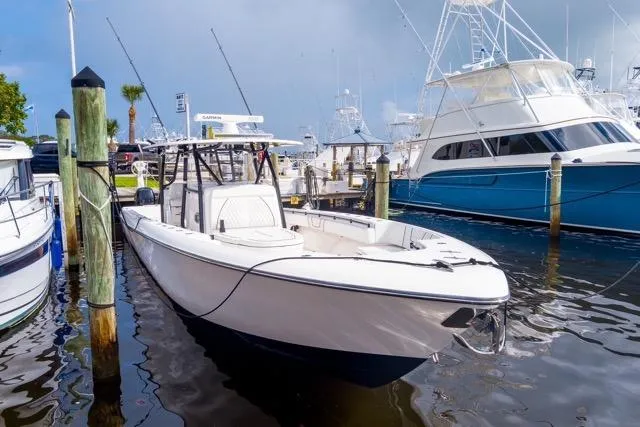 Slide: The Image of 2020 Contender 44 ST boat with open hatch and four powerful outboard engines. - 24