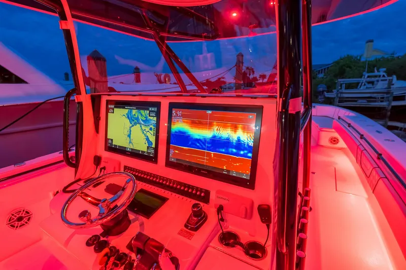 Slide: The Image of 2020 Contender 44 ST boat docked with triple outboard engines. - 29