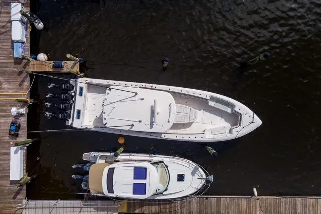 Slide: The Image of 2020 Contender 44 ST boat interior with blue LED lighting and advanced navigation displays. - 32