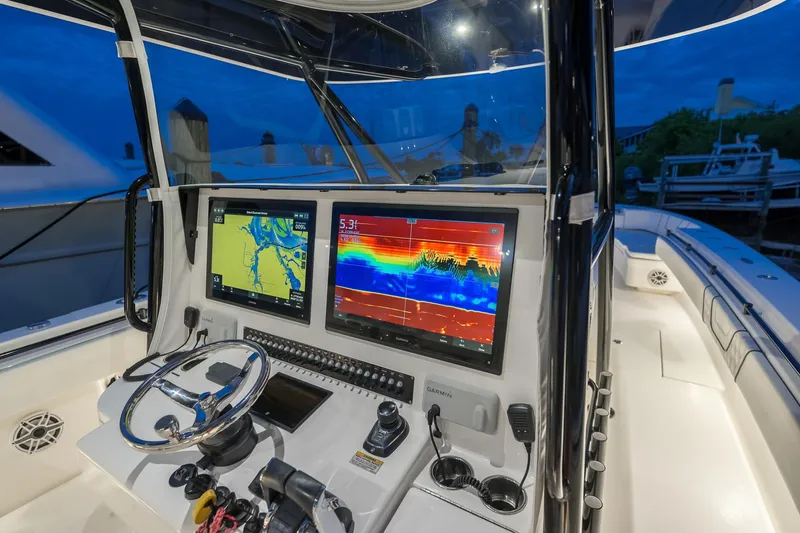 Slide: The Image of Cockpit of 2020 Contender 44 ST boat with advanced navigation displays. - 37